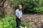 Matthew Offord MP viewing sewage at the Welsh Harp in West Hendon