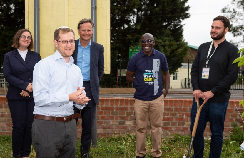 Matthew Offord with Mill Hill community members planting a tree