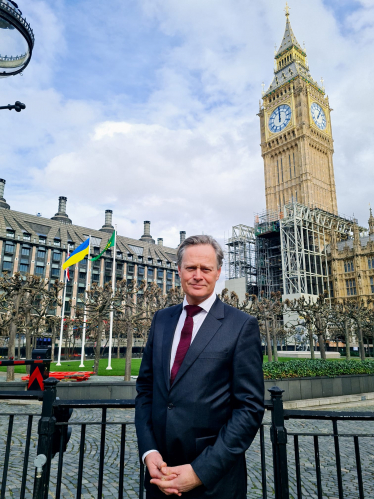 Matthew Offord MP with the Ukrainian flag flying outside Parliament